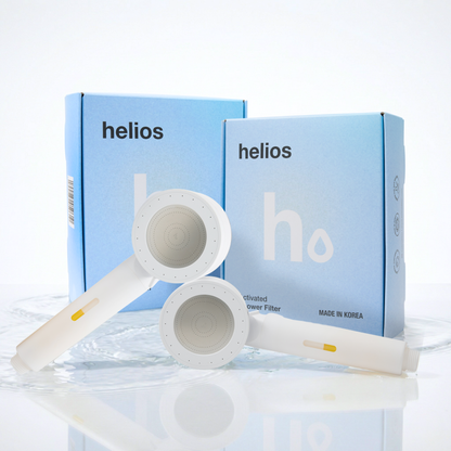 Two Helios Showerhead Filters with branded boxes
