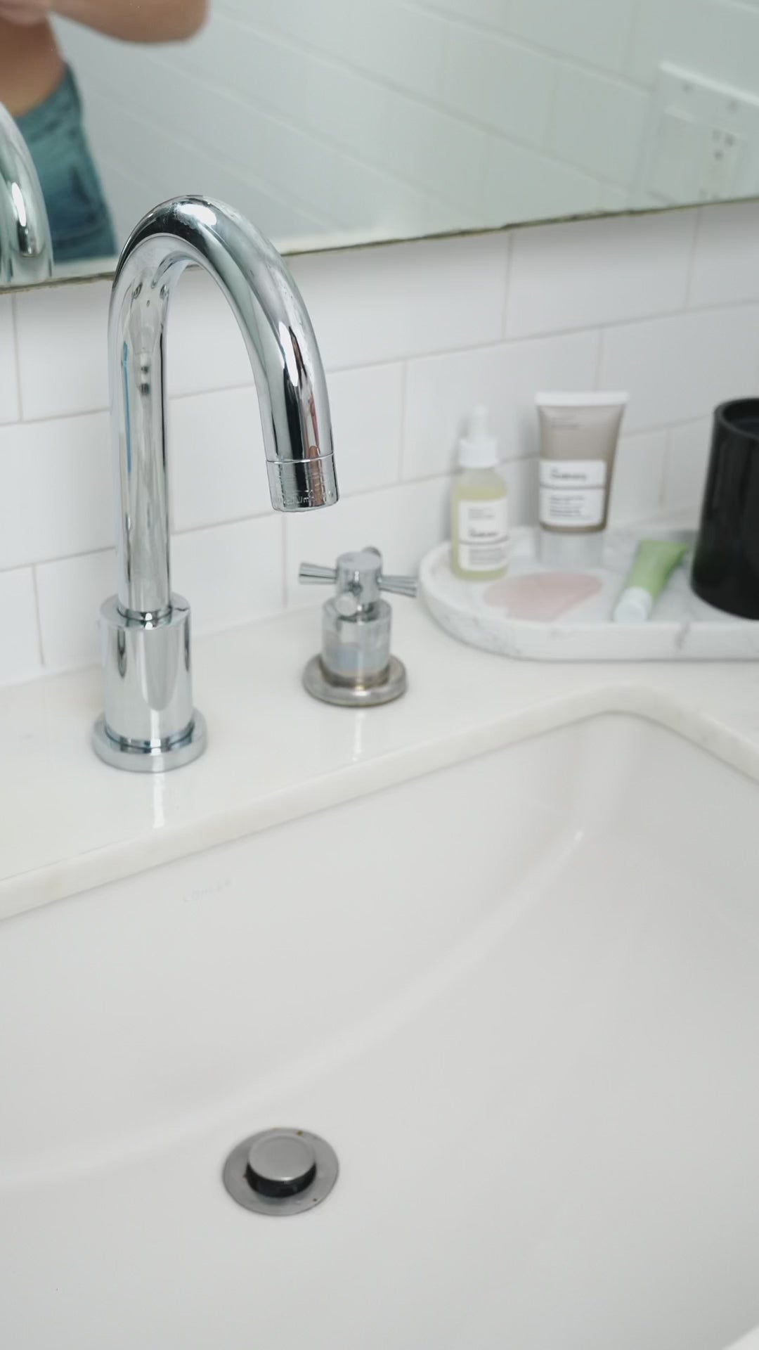 Load video: Women doing face routine with helios sink filter